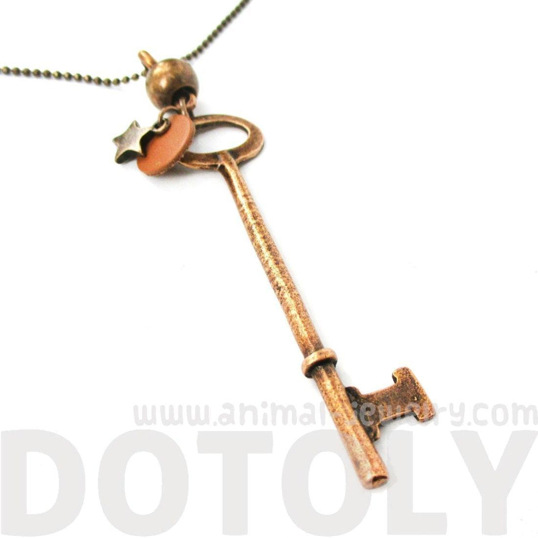 Long Skeleton Key and Star Shaped Pendant Necklace in Brass | DOTOLY